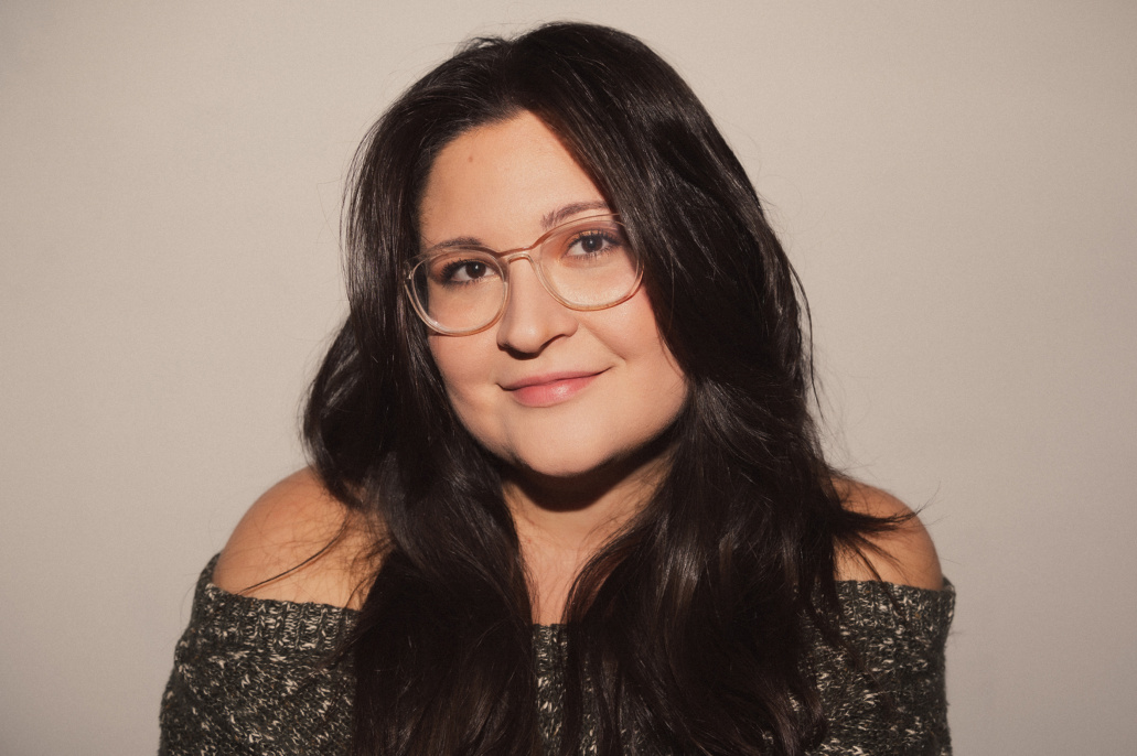 boston music photographer and commercial beauty photographer lisa czech white woman with dark hair and glasses smiles at the camera